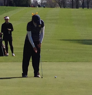 Courtney Kronmuller putting for the final time in her collegiate career